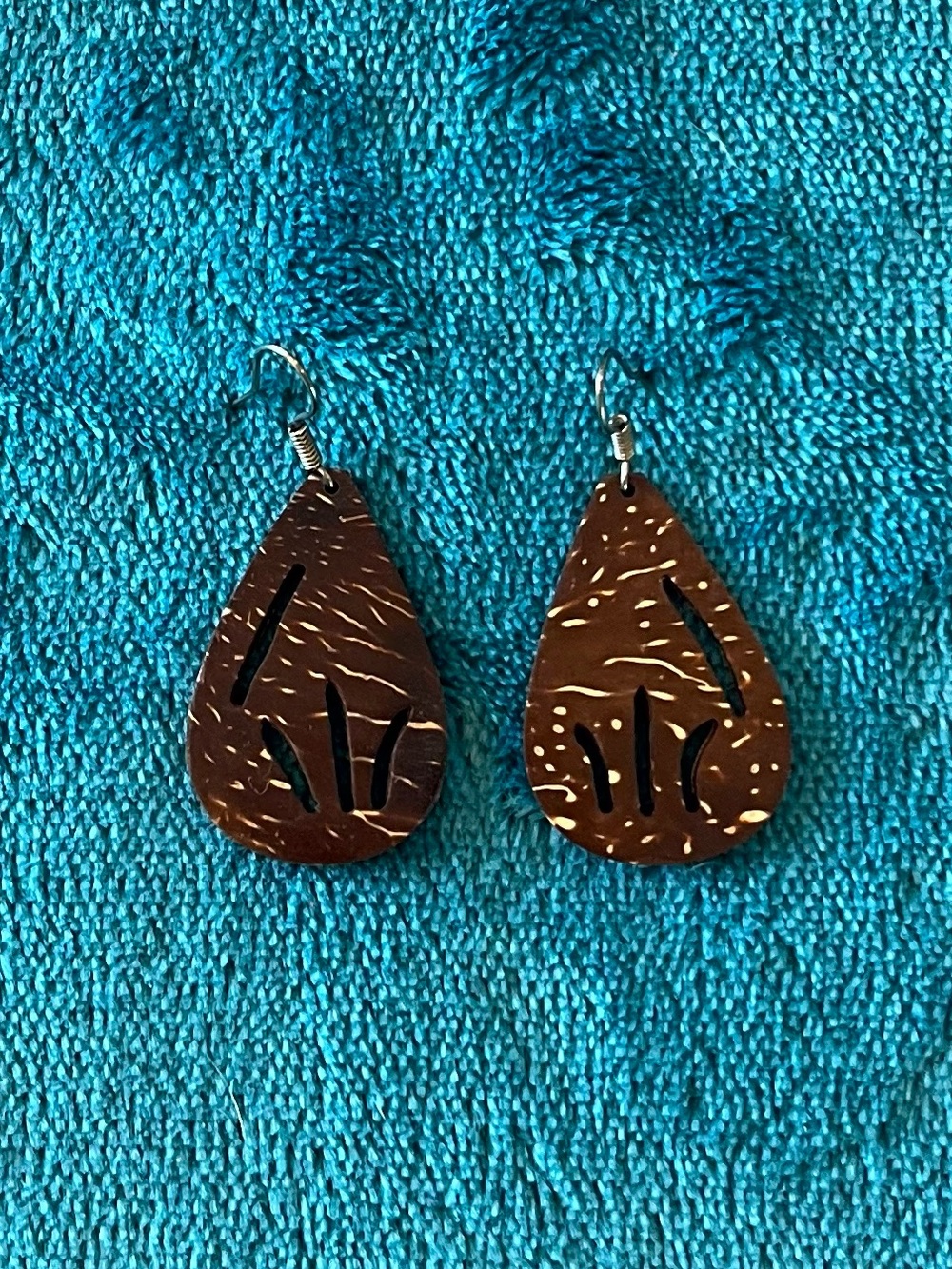Coconut shell carved teardrop earrings.